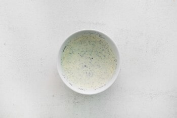 poppy seed dressing in a white bowl.