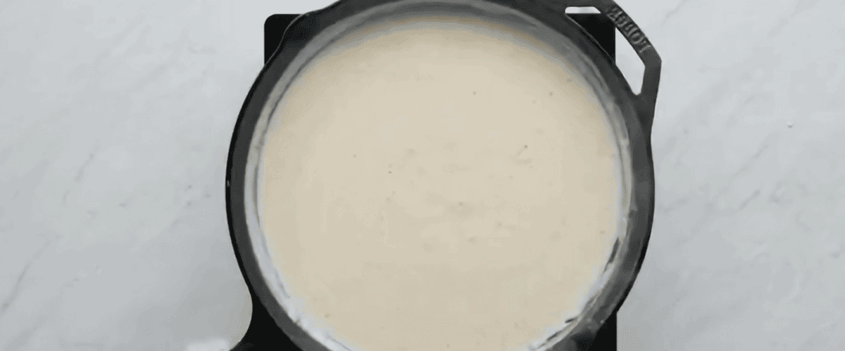 Sour cream whisked into the milk and flour mixture. 