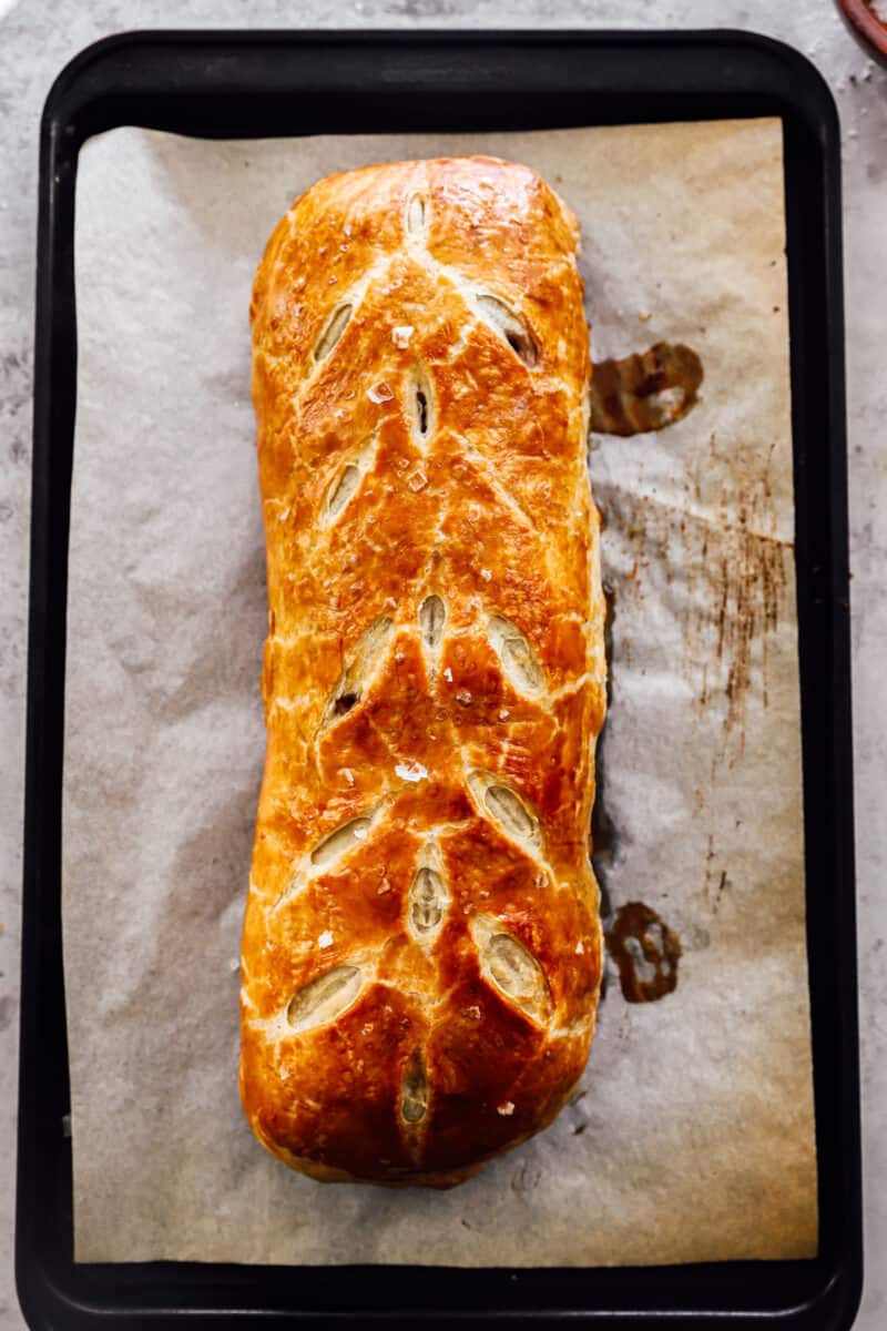 baked beef wellington on a baking sheet.