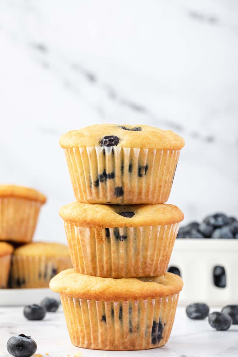 3 blueberry pancake muffins stacked on top of each other.