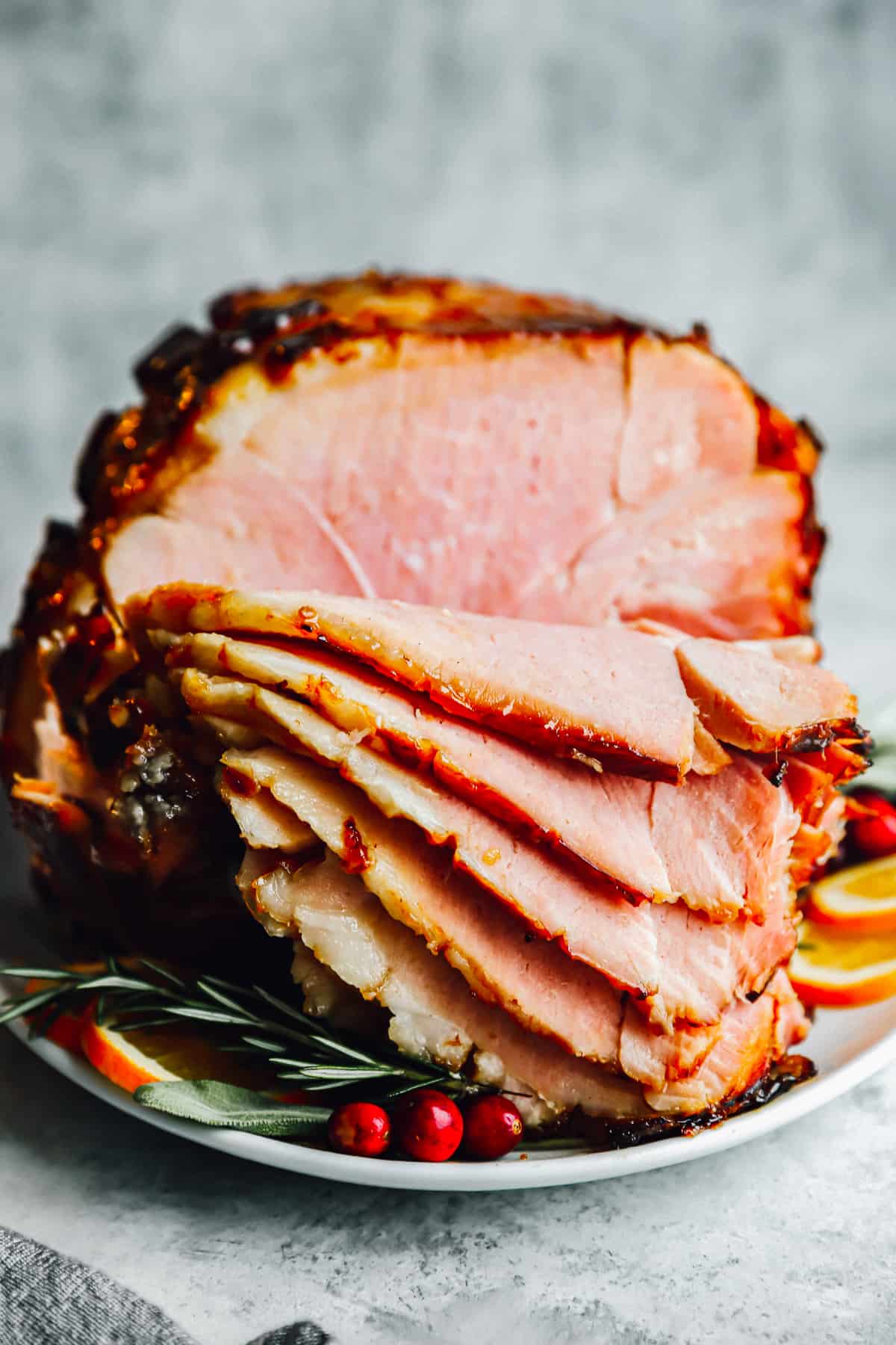 front view of a brown sugar glazed ham that's been sliced