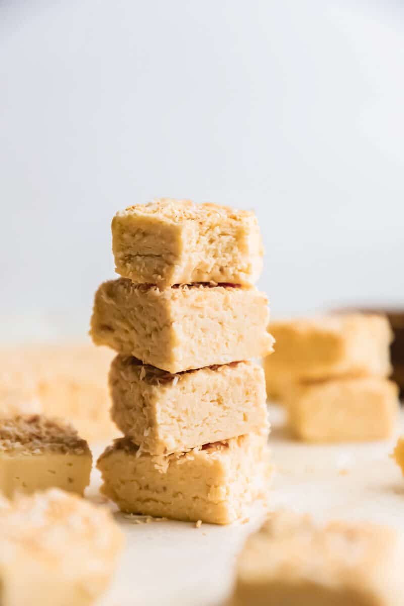 4 stacked pieces of coconut fudge.