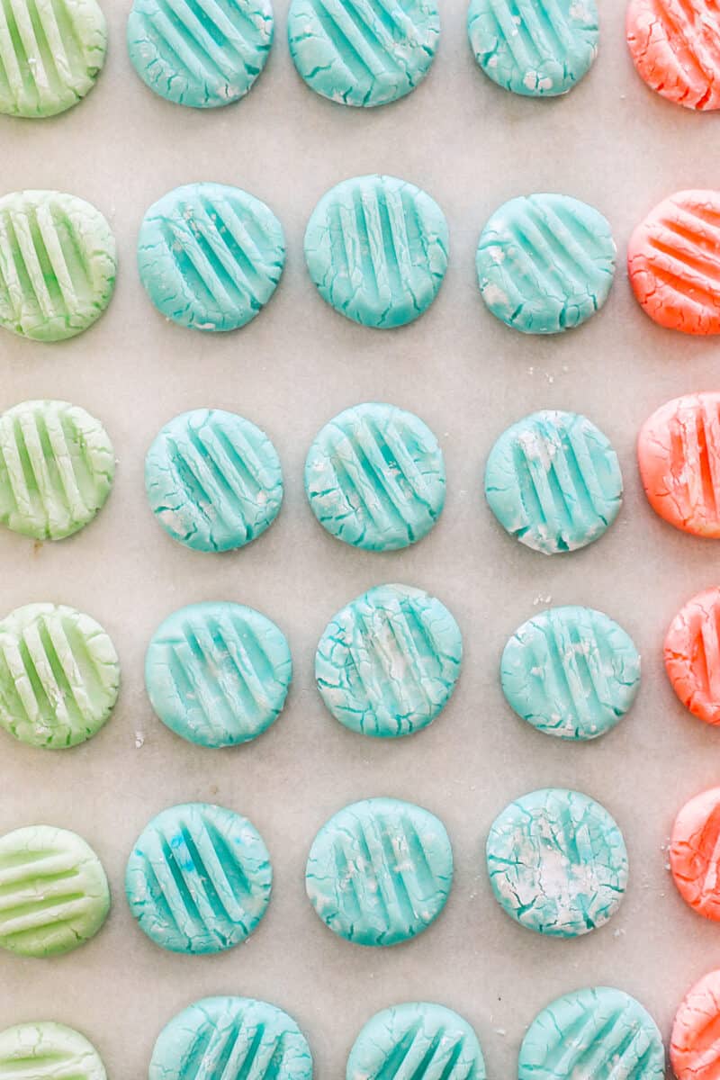 close up view of cream cheese mints on a baking sheet.