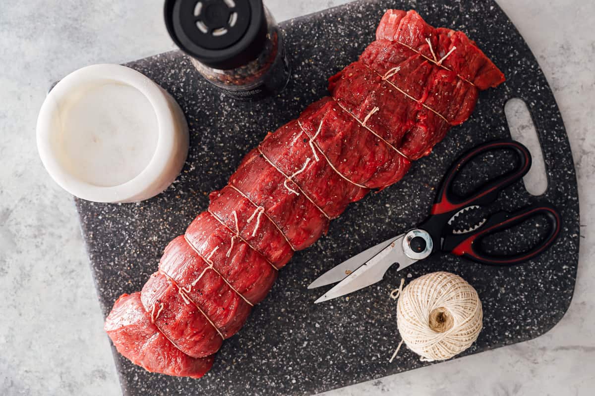 overhead view of ingredients for beef wellington on a gray cutting board.