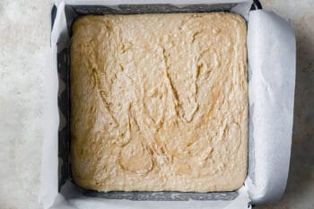 coconut fudge in a square baking pan.