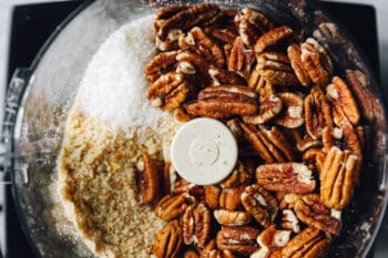 pecans added to a food processor.