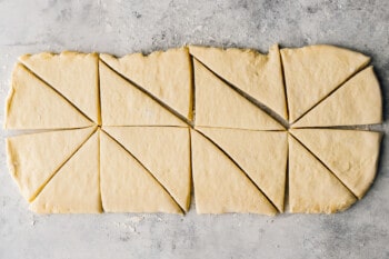 croissant dough cut into 16 triangles.