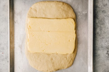 butter placed in the center of croissant dough.