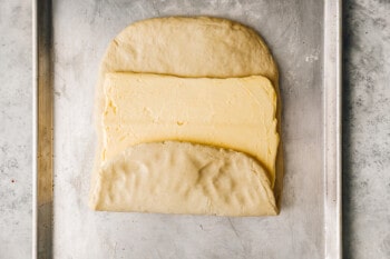 bottom third of croissant dough folded over butter.