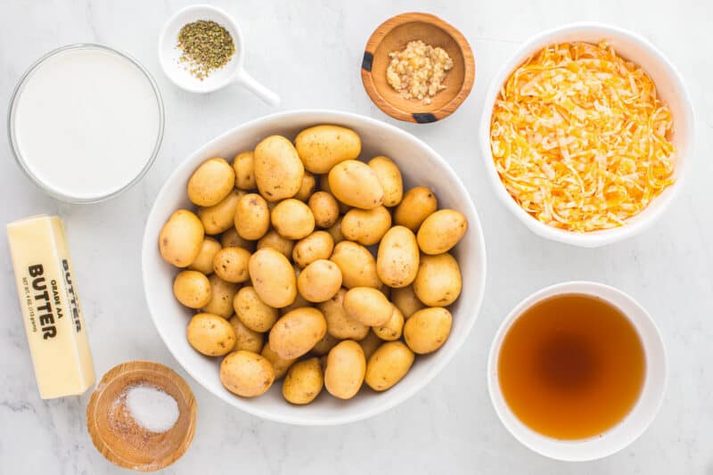 overhead view of ingredients for instant pot scalloped potatoes in individual bowls.