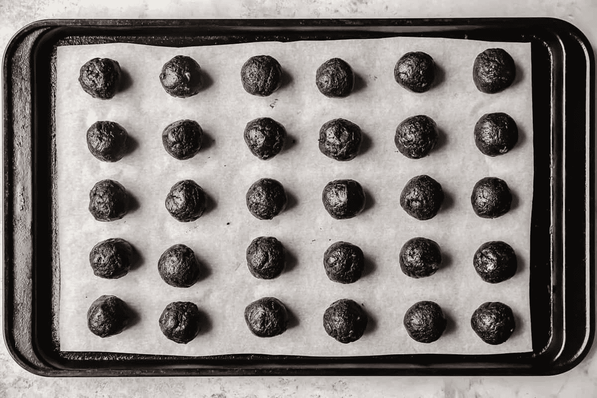 Oreo cookie balls on a baking sheet. 
