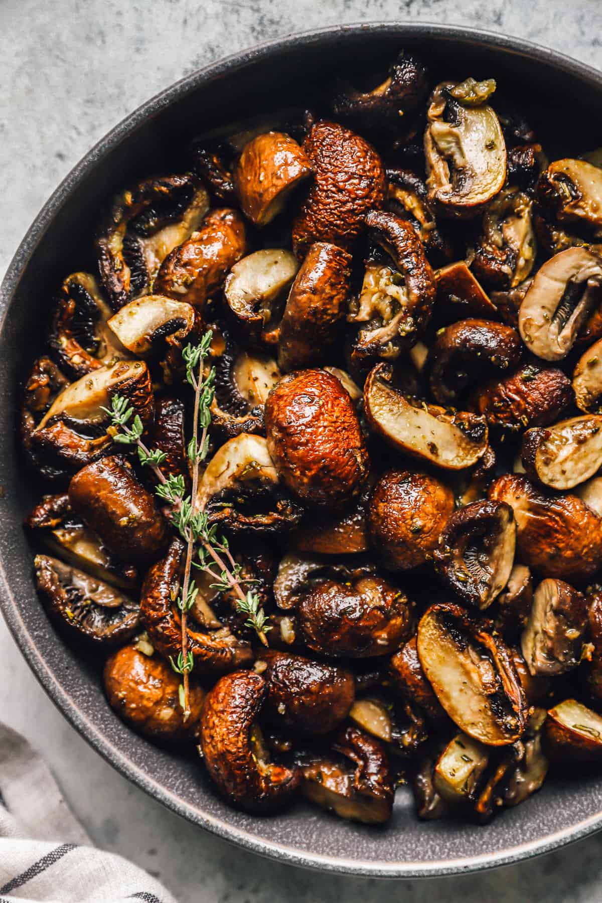 roasted mushrooms in a gray serving bowl.