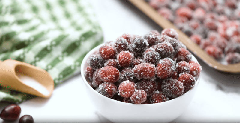 Sugared cranberries elegantly displayed in a lovely bowl.
