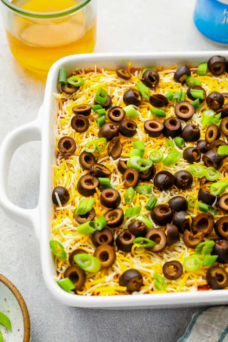 Partial view of 7 layer dip in a rectangular baking pan.