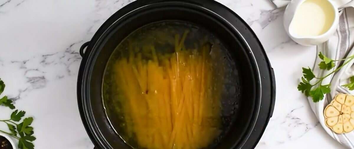 Fettuccine noodles in water in the Instant Pot.  - 8