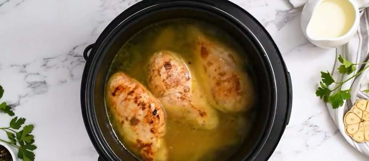 Chicken sitting on top of the pasta in the Instant Pot.  - 9