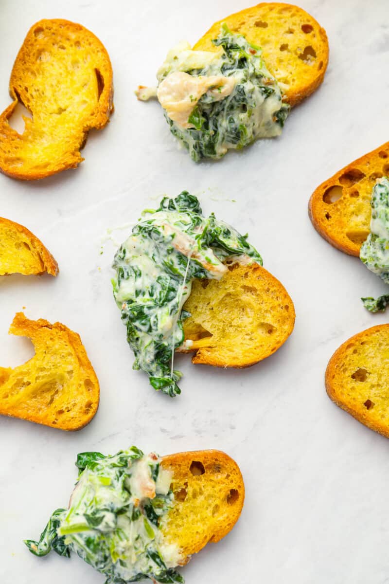 bacon spinach dip on slices of toasted bread.