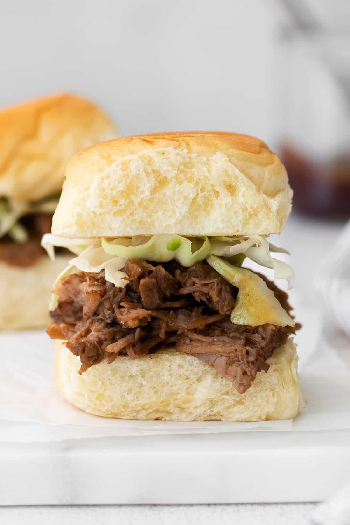 instant pot pulled pork slider on white serving tray