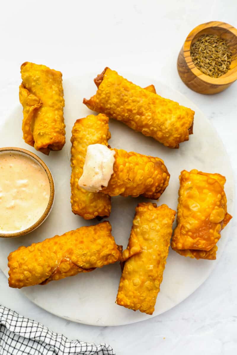 https://www.thecookierookie.com/wp-content/uploads/2023/01/reuben-egg-rolls-recipe-800x1200.jpg