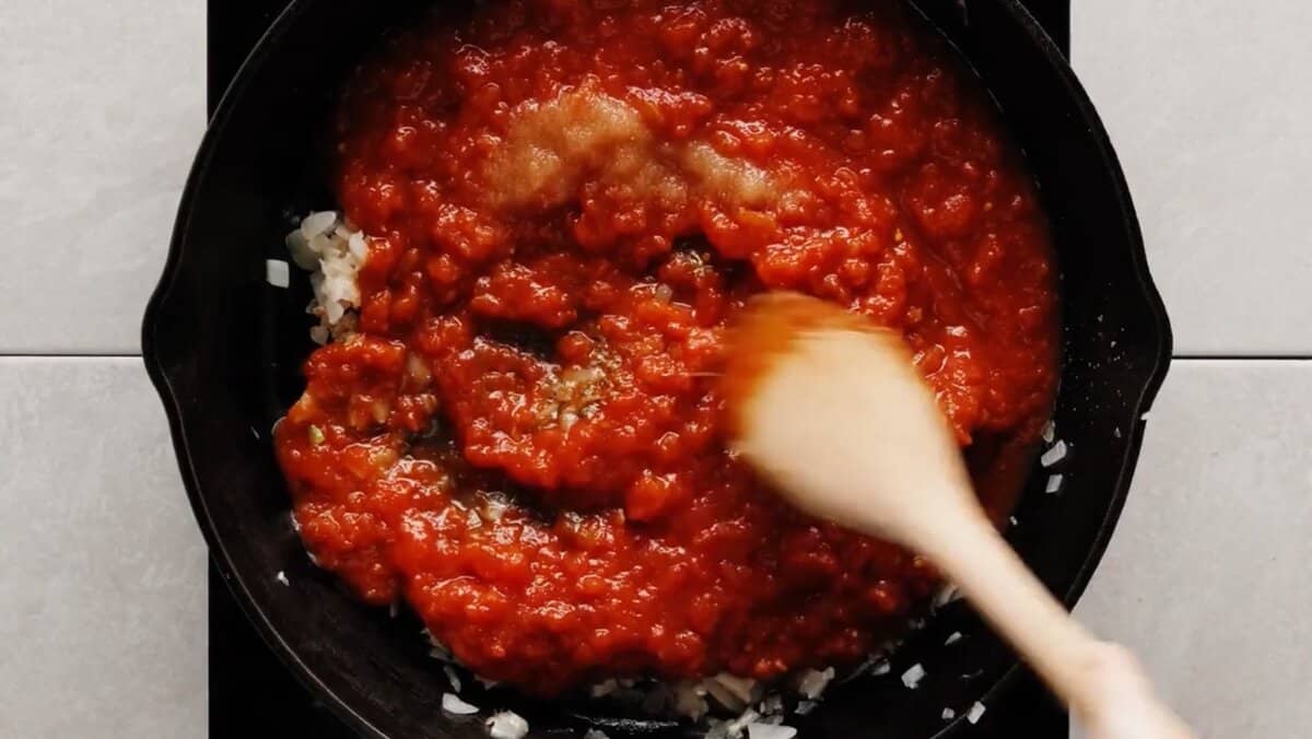 ingredients mixed together to make pizza sauce for deep dish pizza
