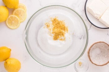 sugar and lemon zest in a glass bowl.