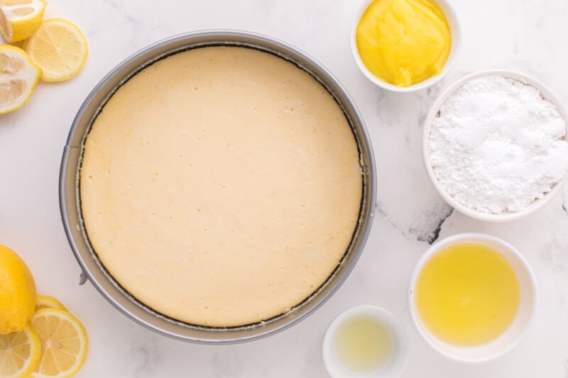 baked lemon meringue cheesecake in a springform pan.