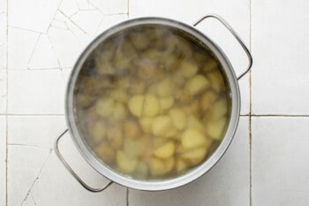 boiled diced potatoes in a pot.