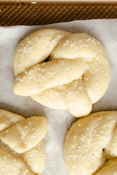 close up of proofed homemade pretzels with salt.