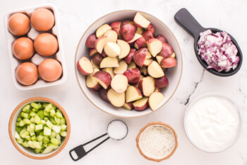 overhead view of ingredients for ranch potato salad in individual bowls.