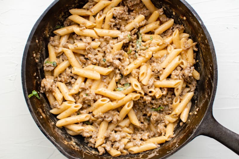 sausage pasta in a cast iron pan.