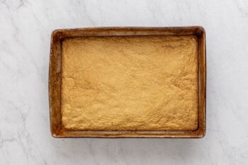 smores bar dough in a rectangular baking pan.
