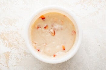 strawberry truffle filling in a white bowl.