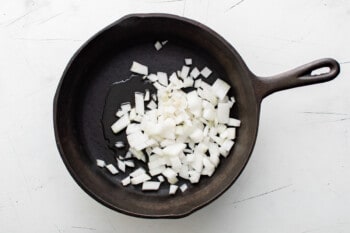 onions in a cast iron pan.