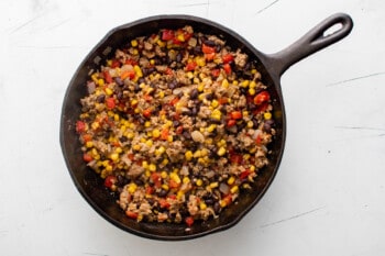 cooked taco lettuce wrap filling in a cast iron pan.