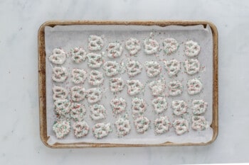 christmas pretzels on a baking sheet.