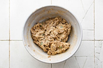 zucchini ravioli filling in a white bowl.