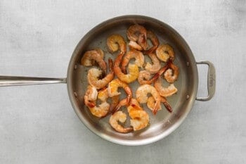 shrimp cooking in a frying pan.