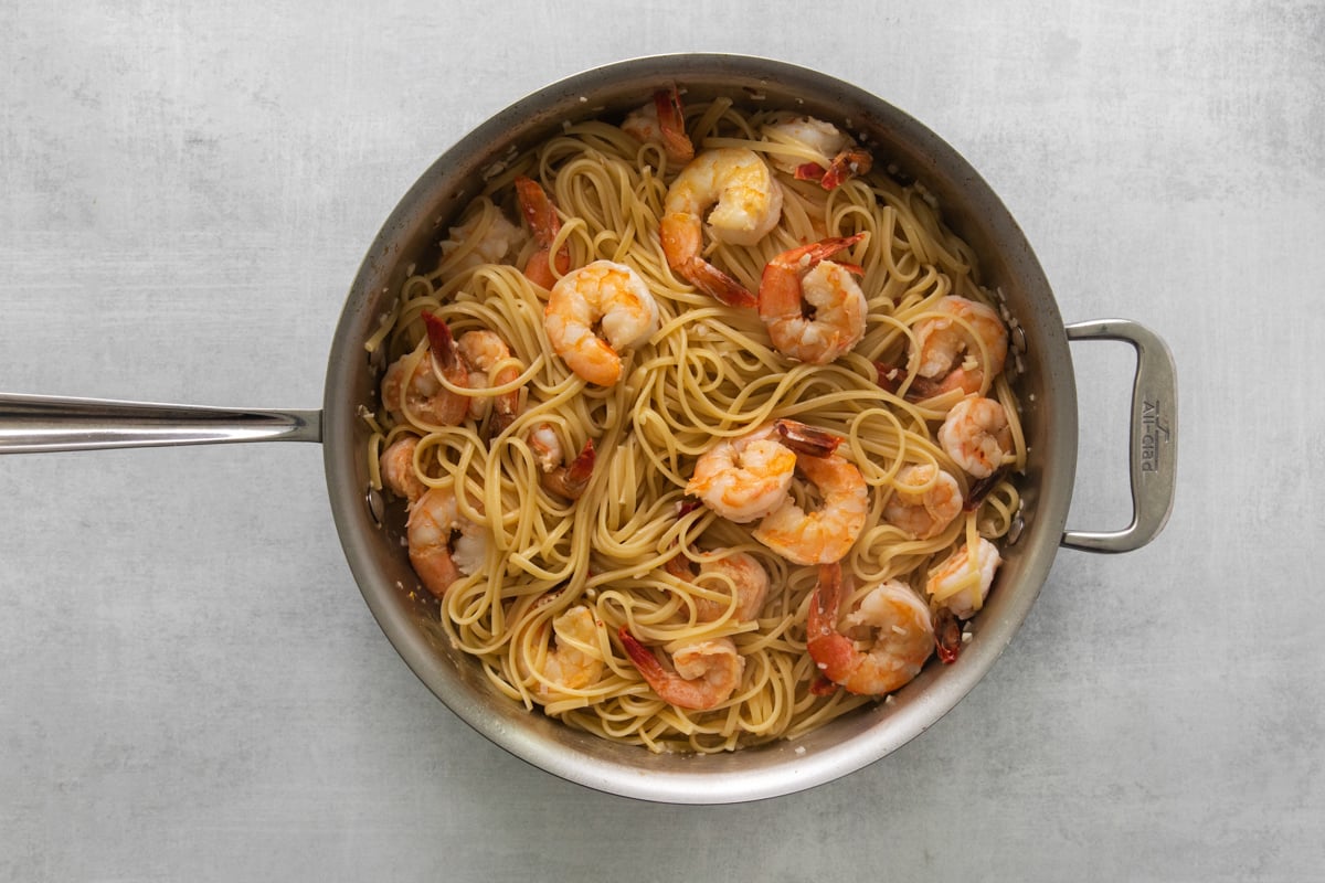 Shrimp scampi in a frying pan.