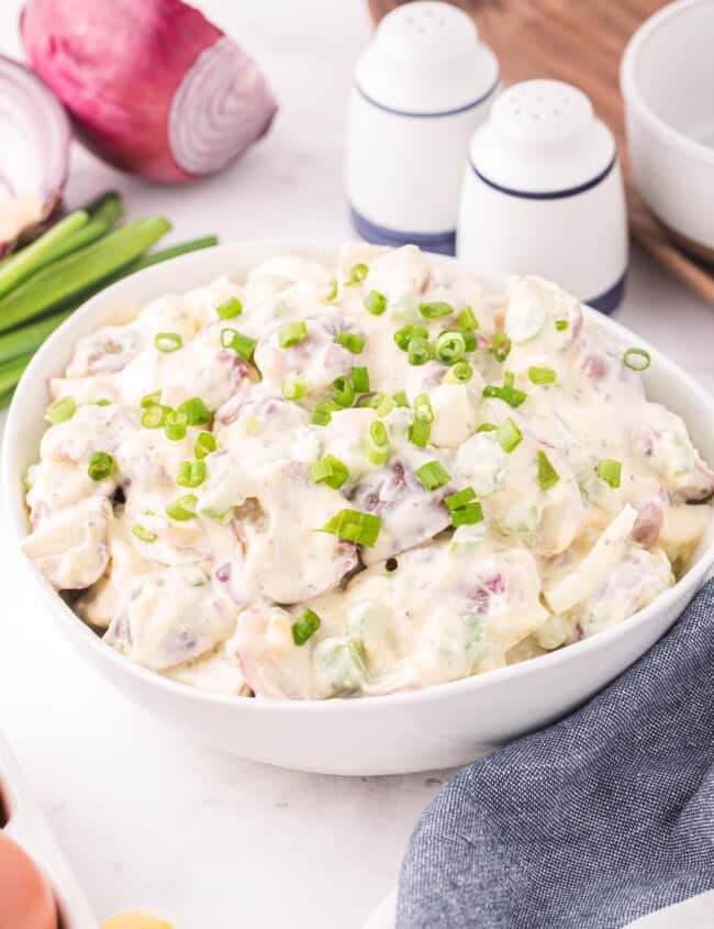 three-quarters view of ranch potato salad in a white bowl.