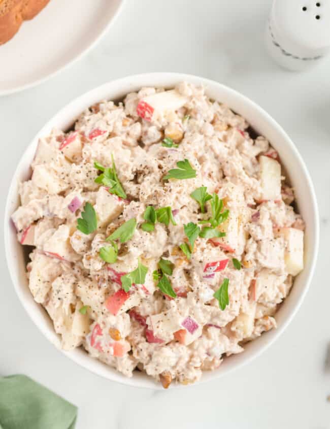 overhead view of tuna salad in a white bowl.
