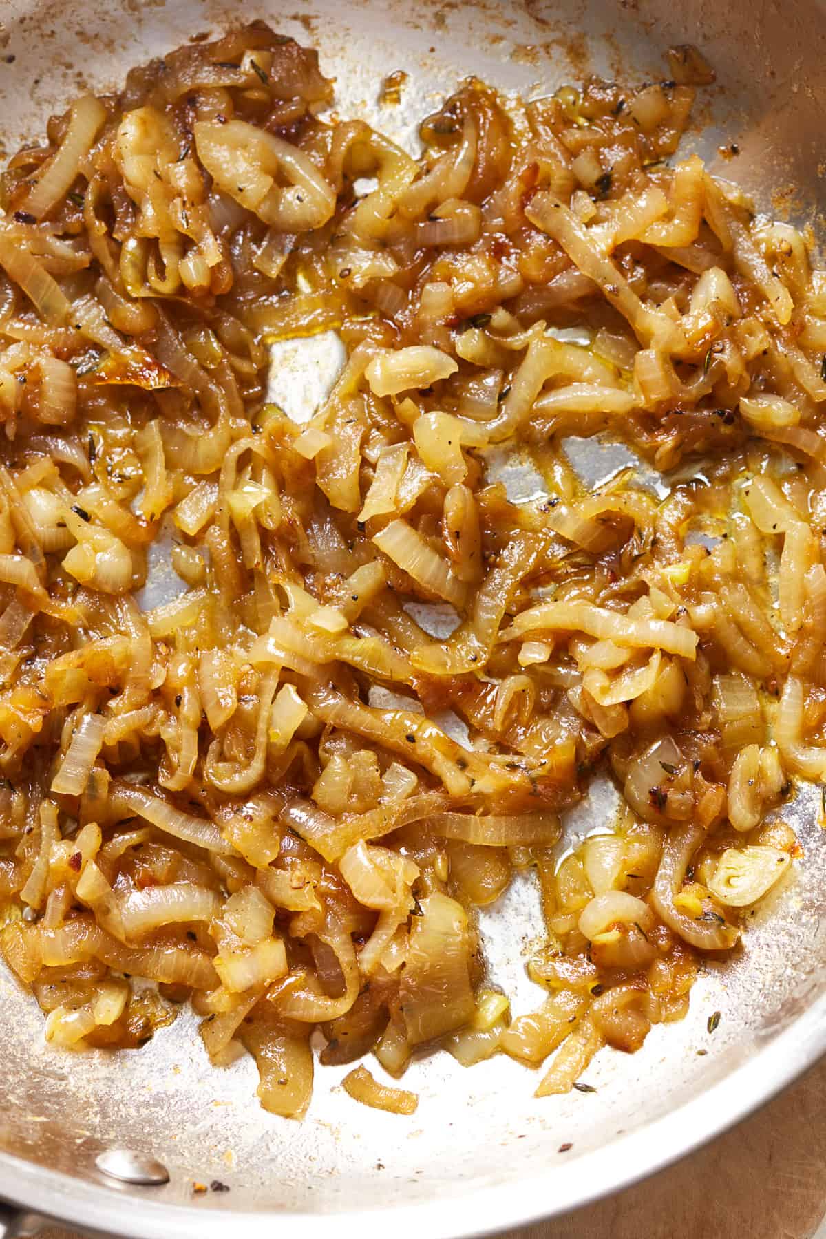 overhead view of caramelized onions in a pan.