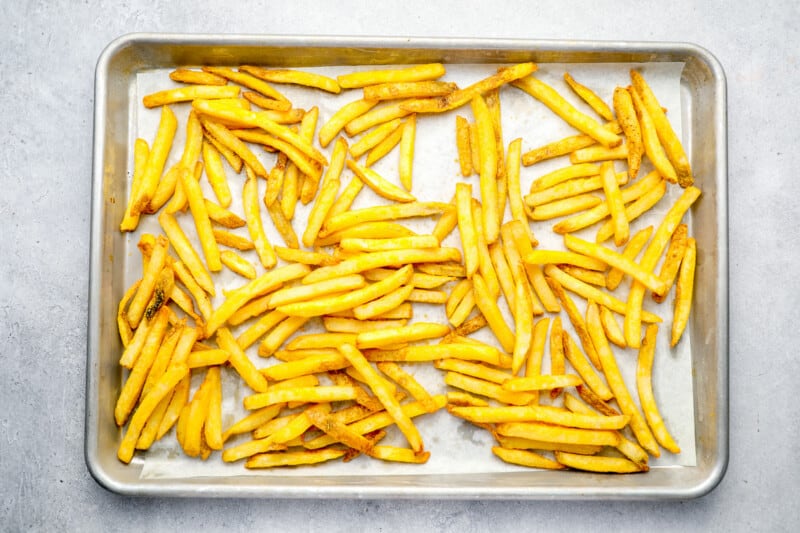 frozen french fries on a baking sheet.