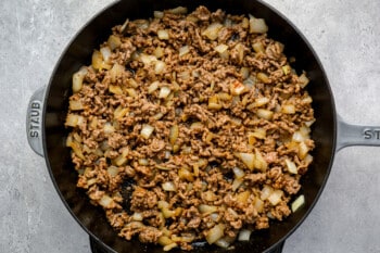 ground beef, onions, and taco seasoning in a skillet.