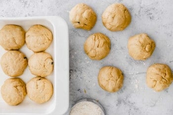 hot cross bun dough shaped into 12 balls.