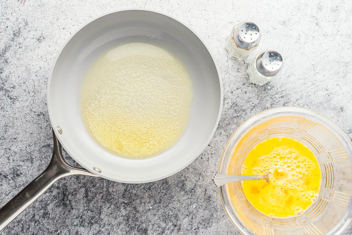 overhead view of melted butter in a frying pan.