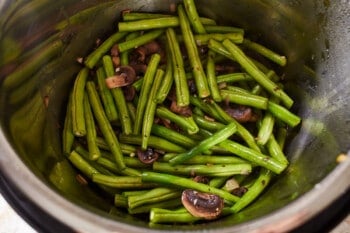 green beans added to sauteed mushrooms and onions in an instant pot.