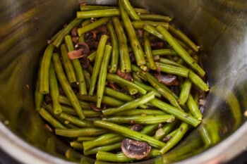 cooked green beans, mushrooms, and onions in an instant pot.
