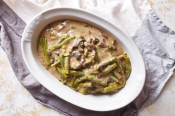 instant pot green bean casserole poured into a white oval serving dish.