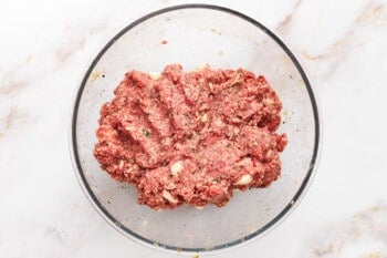 meat mixture with mozzarella for mozzarella stuffed meatloaf in a glass bowl.