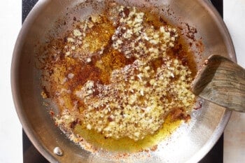 garlic sizzling in a frying pan.